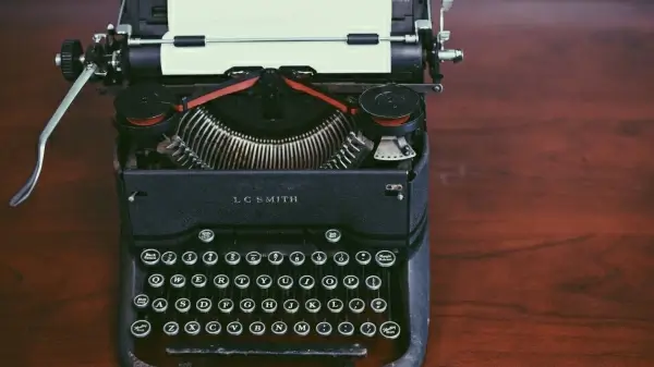 antique typewriter on wooden table