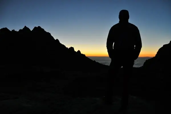 backlit climber dawn dusk evening landscape moon