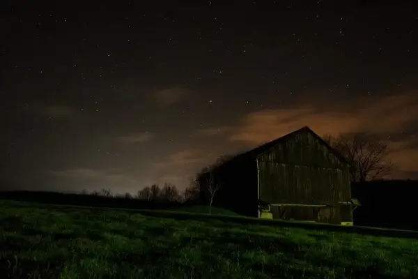 barn building cloud dark farm field grass night