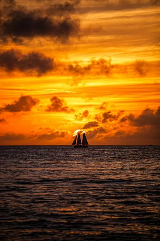 beach scenery picture dark sunset boat cloudy sky