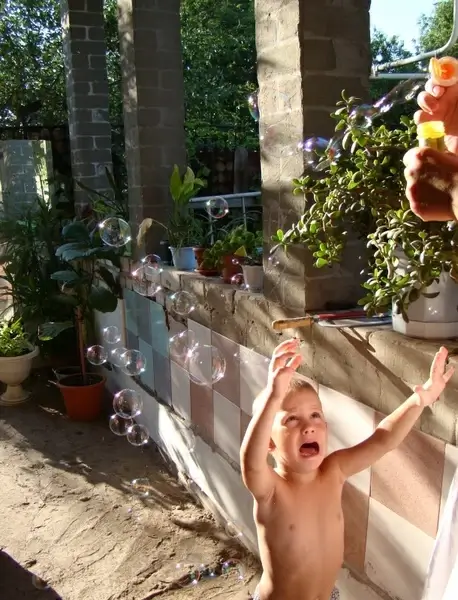 boy soap bubbles sun