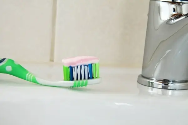 brush with toothpaste