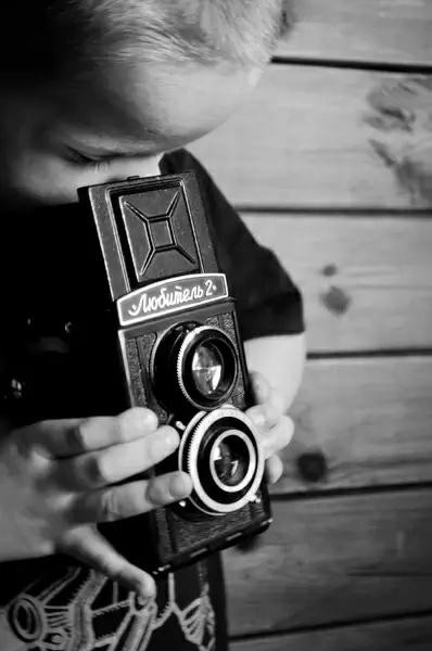 child and reflex camera