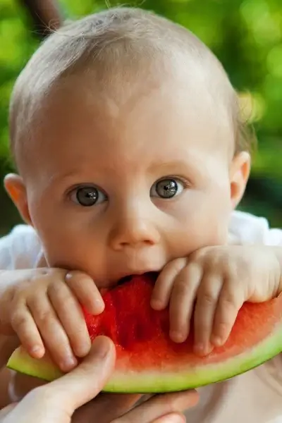 child eating watermelon