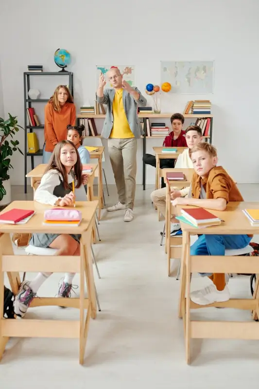 class room picture elegant dynamic posing pupils teacher 