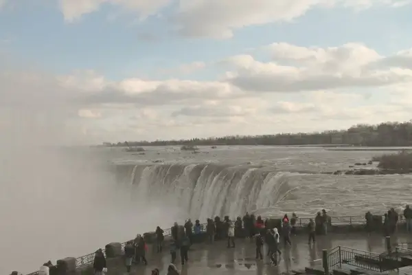 crowd of people watching niagara falls 