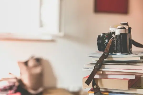 digital camera on a stack of book