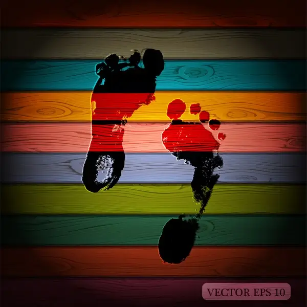 foot print on colorful wooden background
