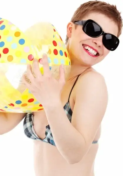 girl in swimsuit with beach ball