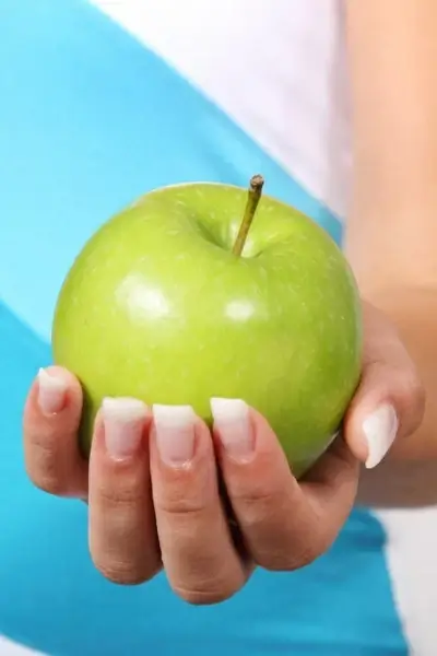 hand holding apple 