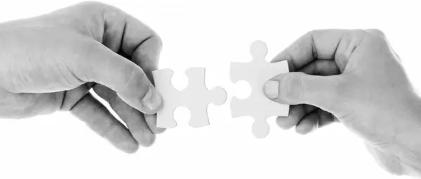 hands holding jigsaw