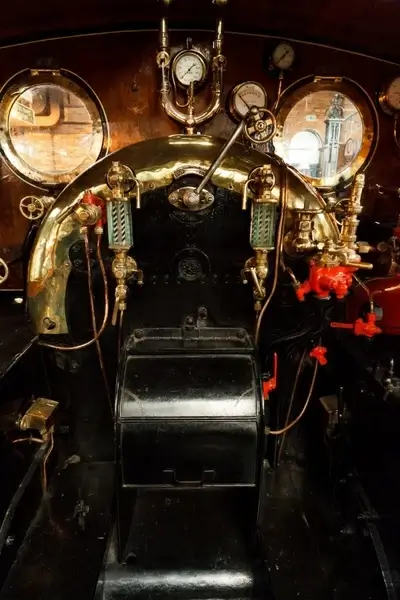 inside the cab of a steam engine