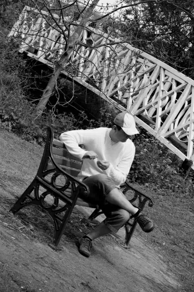 man sitting on bench