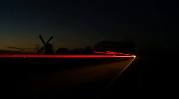 mill during late sunset nice long exposure with car lights