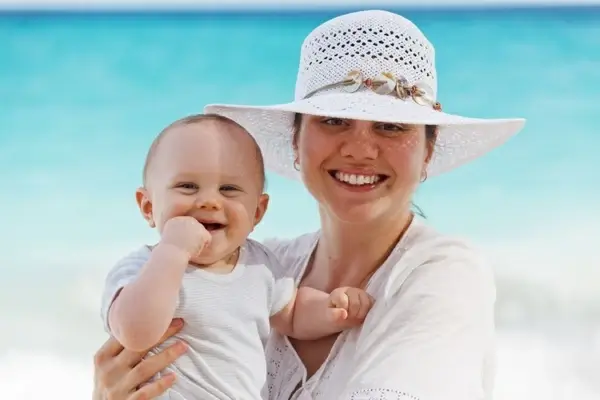 mother and baby on the beach