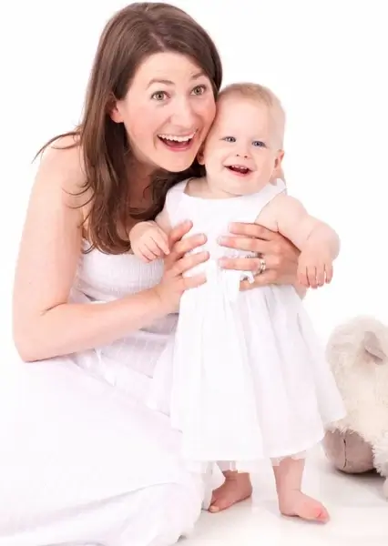 mother and baby smiling