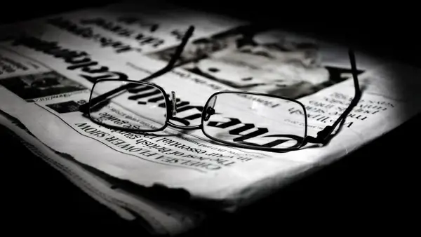 newspapers and glasses