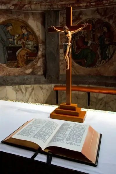 open bible and crucifix