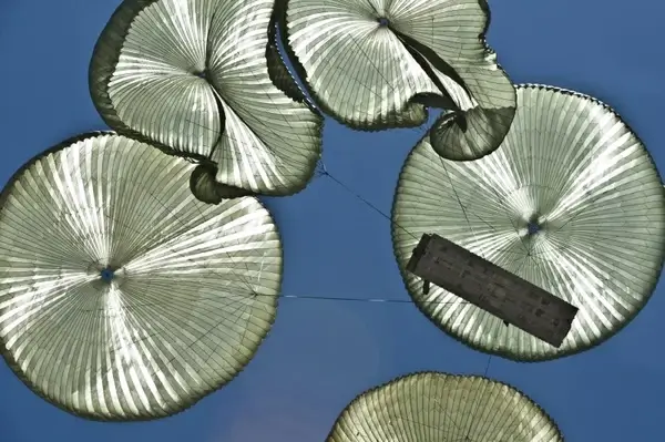 parachutes sky clouds