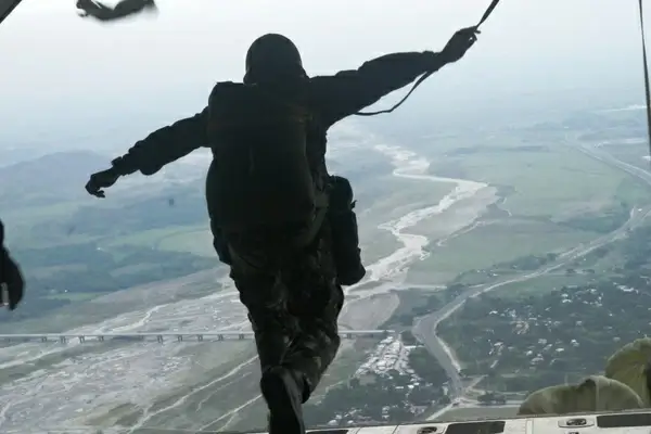 parachutist parachuting jumping out of plane