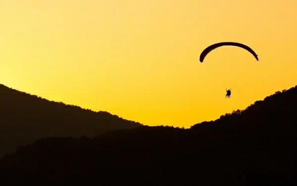 paragliding at sunset