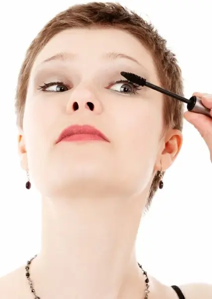 putting on mascara