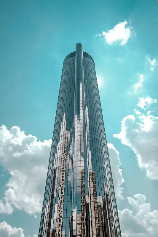 real estate backdrop modern glass wall tower cloudy sky 