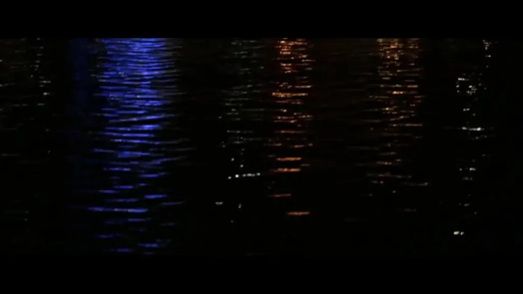 reflection of harbor lights on ripple sea