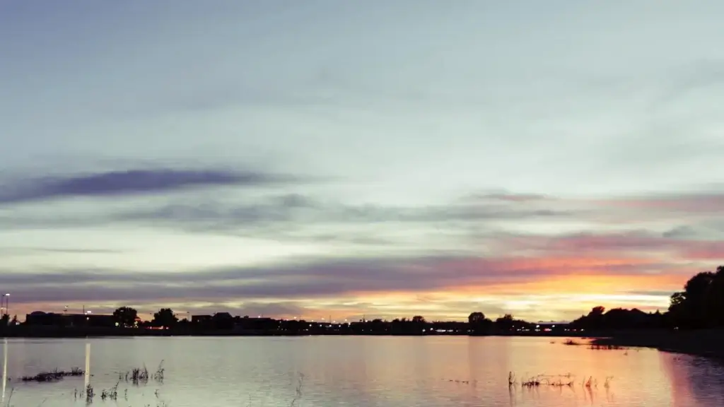 riverside city view at sunset