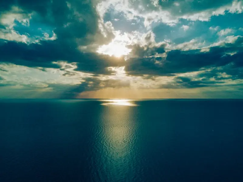 seascape picture contrast tranquil cloudy sky sunrays 