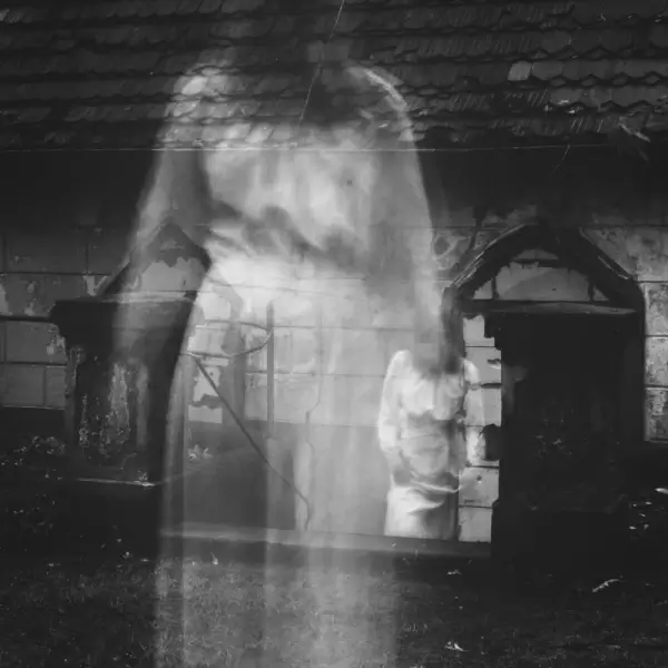 white phantom outside old building
