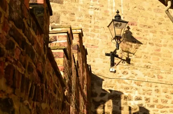 stone wall and the lamp