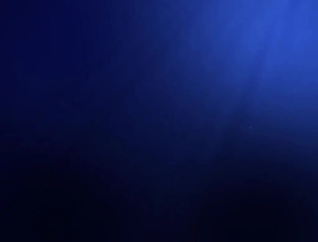 sun rays in dark blue seabed
