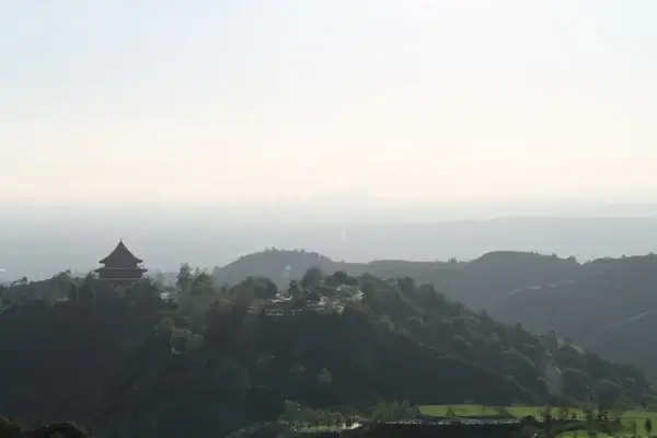 temple on hills with city in background