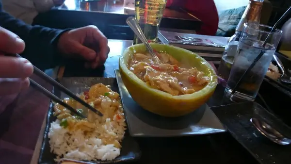 thai curry in a honeydew melon