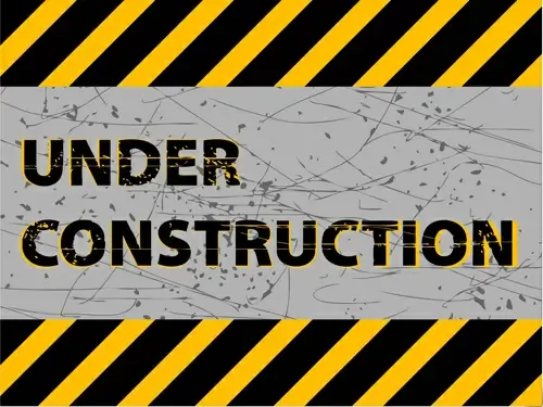 under construction sign grunge background vector