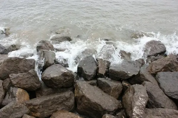 waves crashing on to rocks