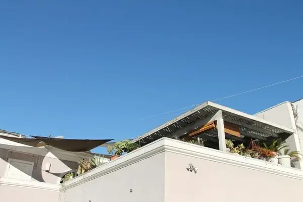white building with rooftop garden