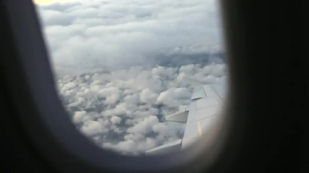 white cloudy scene outside of airplane window