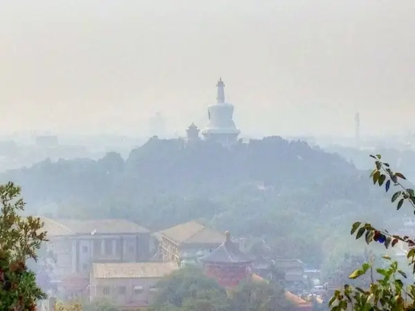 white pagoda in the pollution in beijing china
