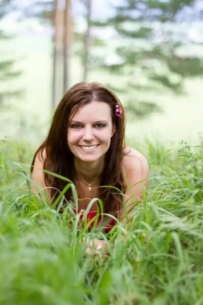 young girl laying in the grass