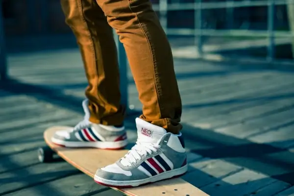 young teen riding a skateboard