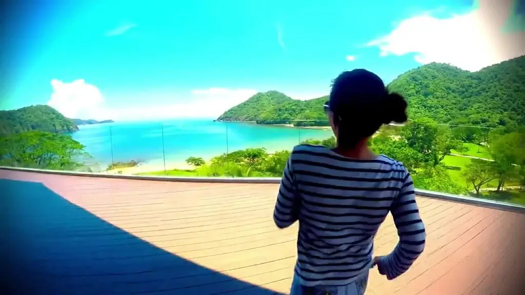 young woman joyful on resort balcony