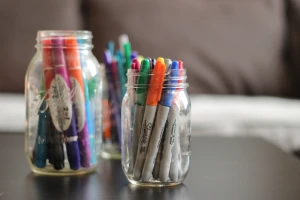 3 glass jars with markers