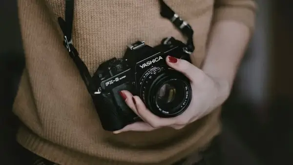 a c camera close up clothes clothing h hand i