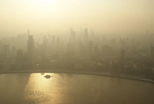 aerial building city down fog mist river shore