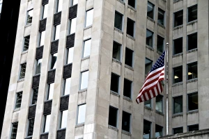 american flag in front of building