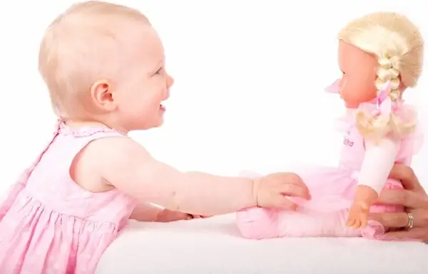 baby and toy doll