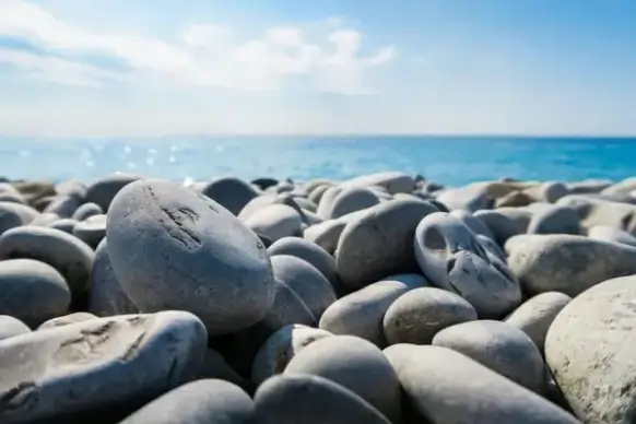 balance beach boulder coast coastline daytime nobody