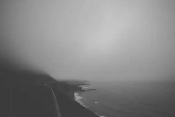 beach black and white boat coast fog haze lake